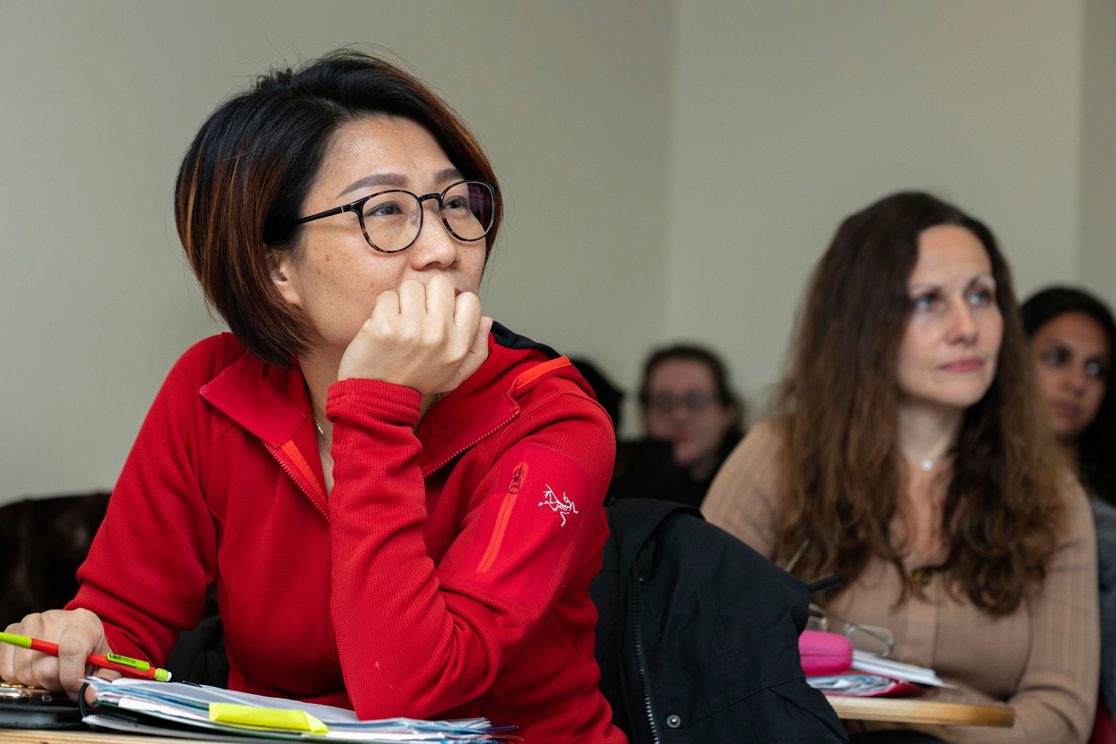 students sitting at desks in a classroom