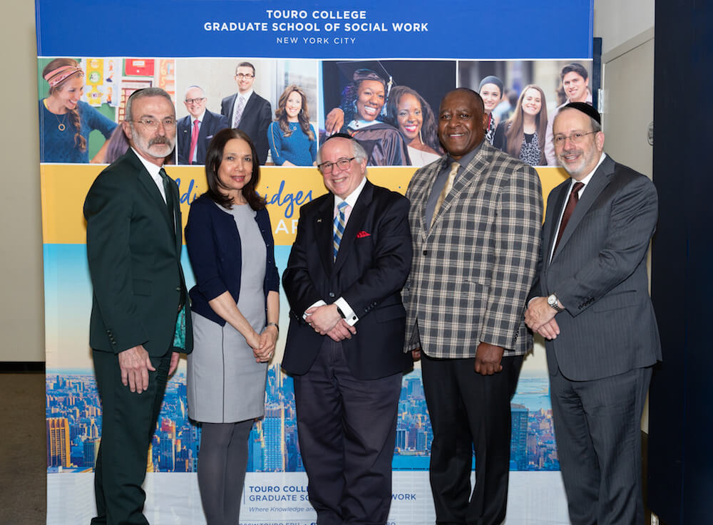 During Touro's Graduate School of Social Work's Community Day on March 13, students and faculty members listened to speeches about resilience from speakers (left to right): David Mandel, CEO of Ohel Children’s Home and Family Services, GSSW's Dr. Annecy Baez, GSSW Dean Steven Huberman, Ph.D., GSSW alumnus Bobby Staley, and Touro Executive Vice President Rabbi Moshe Krupka.