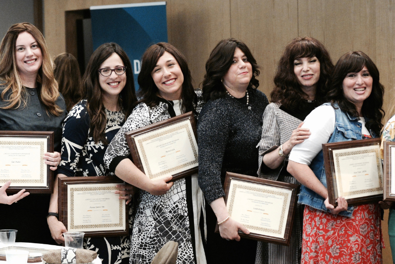 Chesed Leadership Graduates show off their certificates of completion