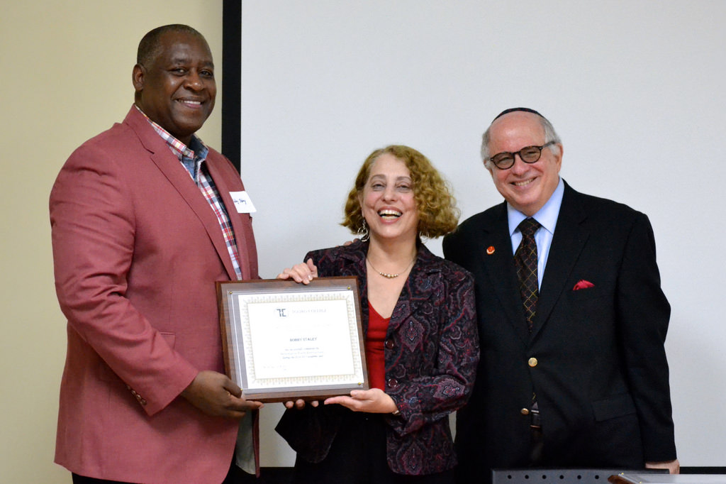 Social worker Bobby Staley receives his certification in field instruction from Prof. Roberta Shiffman and Dr.Steven Huberman. 