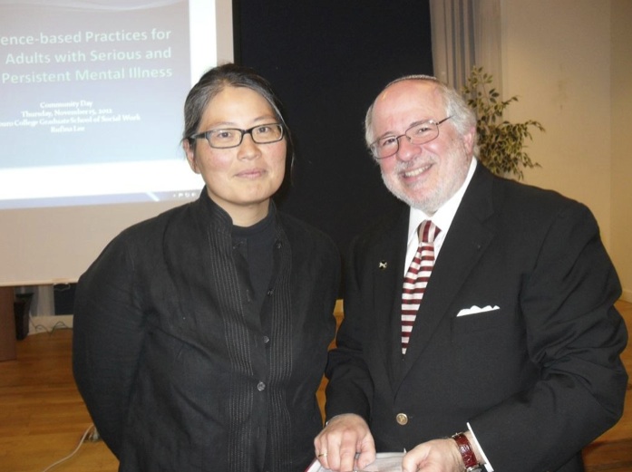 Rufina Lee next to Dr. Steven Huberman, founding dean of the Graduate School of Social Work. 